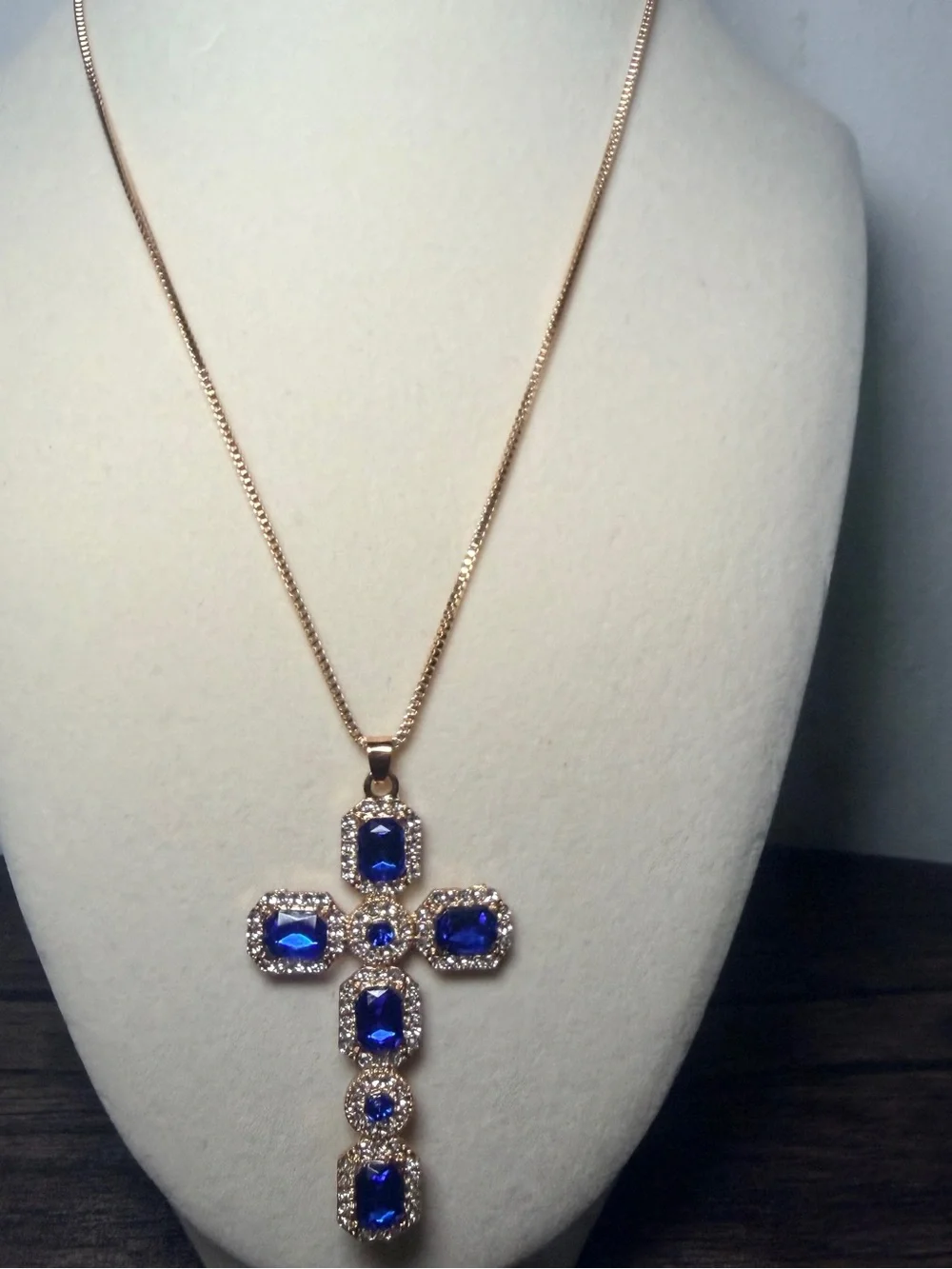 Gold-Tone Cross Pendant Necklace with Deep Blue Stones